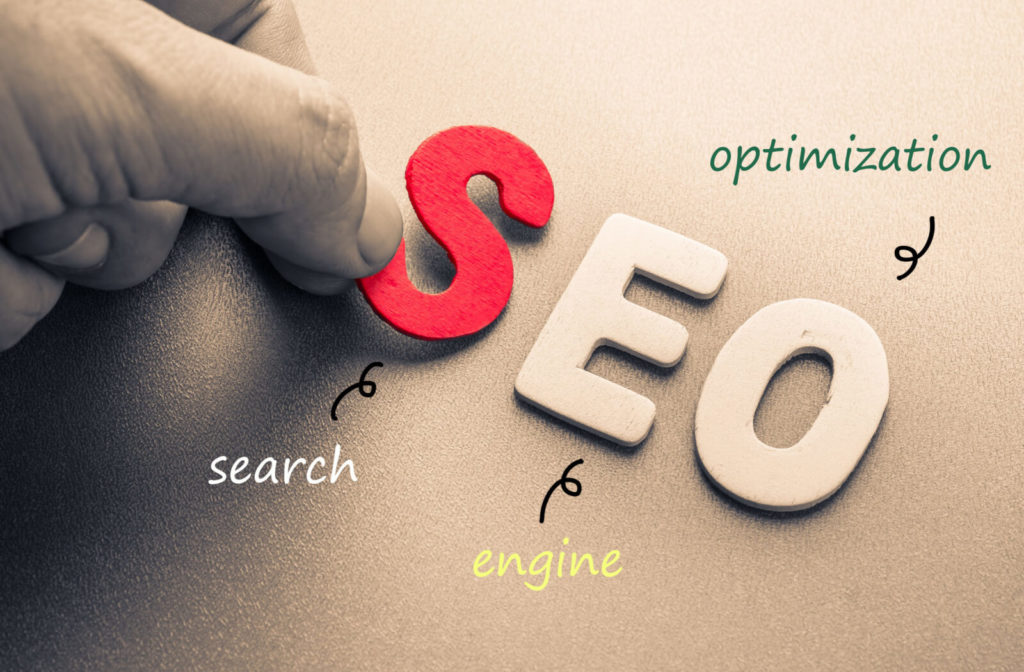 Hand arranged wood letters spelling SEO, the abbreviation for Search Engine Optimization as a marketing technique for optometry practices.