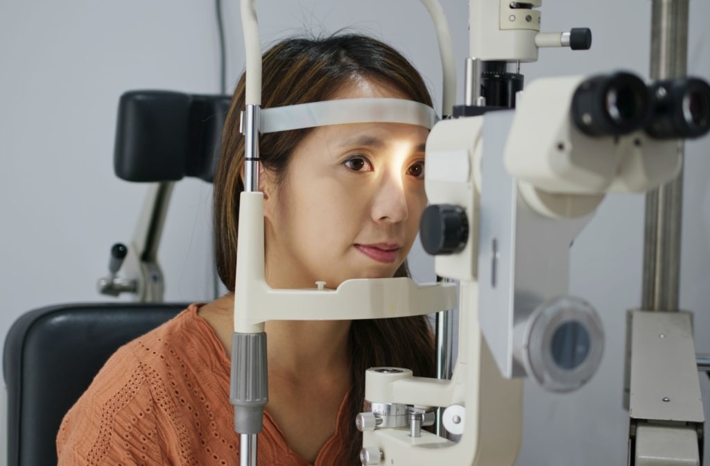 Woman getting her eye exam done at an optometrist.