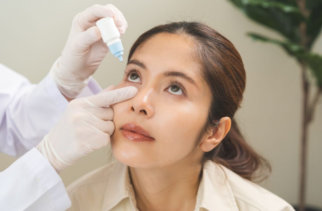 Patient receiving prescription eye drops for dry eye from an optometrist.